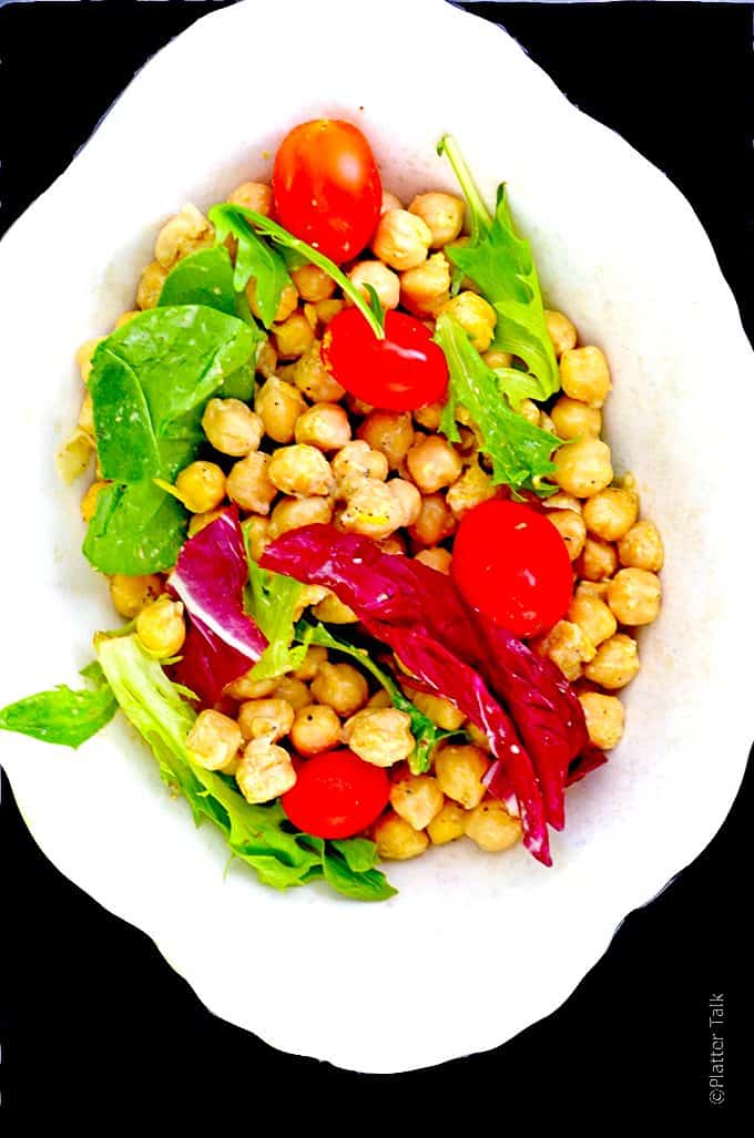 Serving bowl with hummus salad, deconstructed.