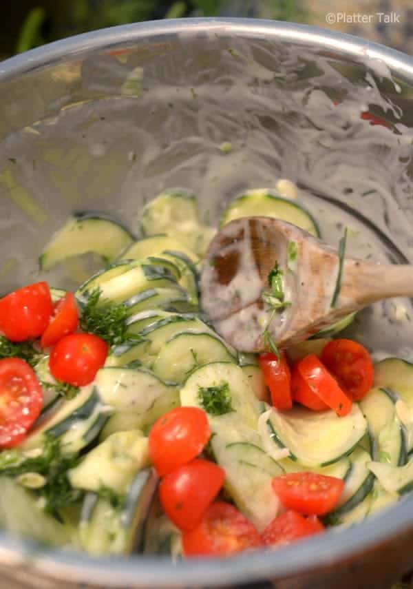 a creamy dill cucumber salad in a bowl.