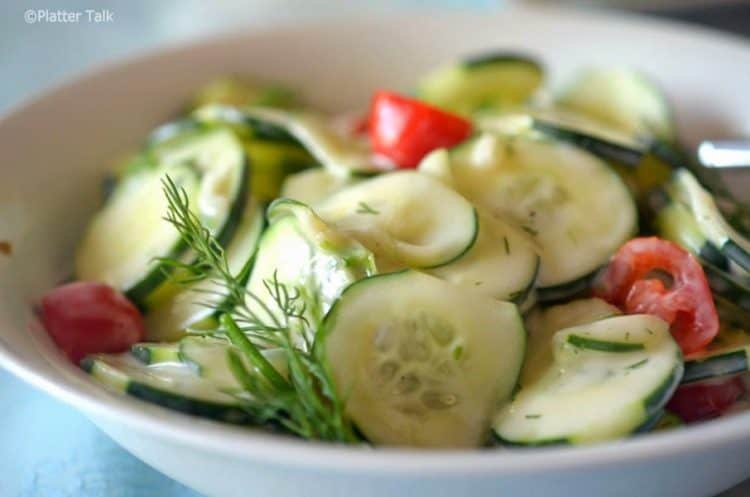 A close-up of cucumbers on a salad.
