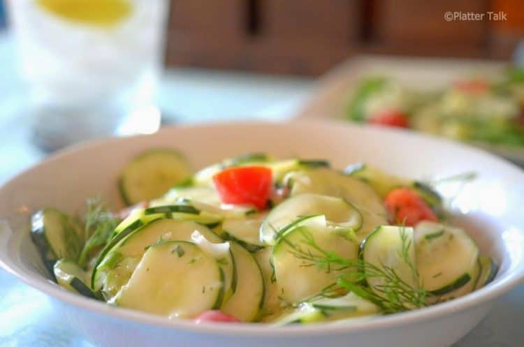 A bowl of cucumber salad.