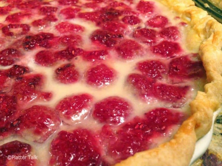 A close up of a raspberry pie