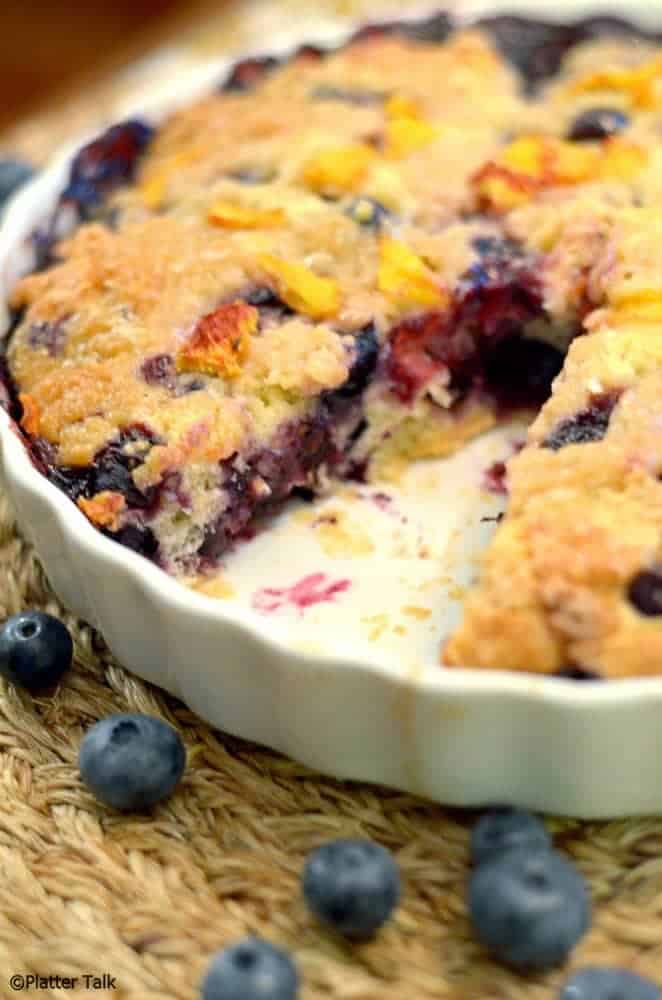 blueberry and peach yogurt streusel in a dish