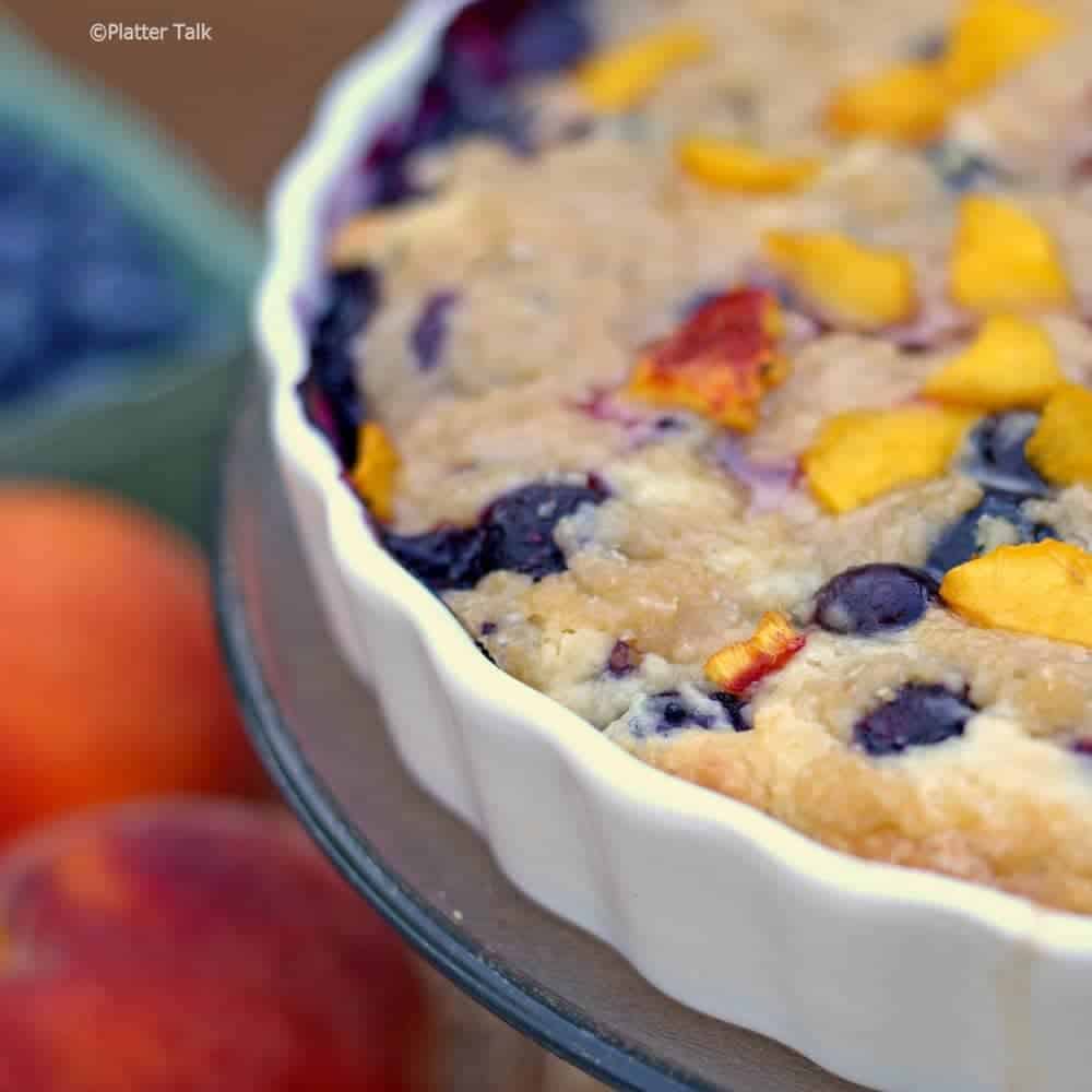 A close up of blueberry and peach yogurt streusel 