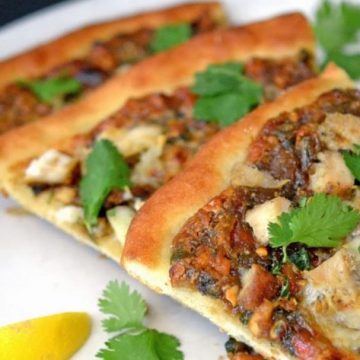 three slices of thai chicken pizza