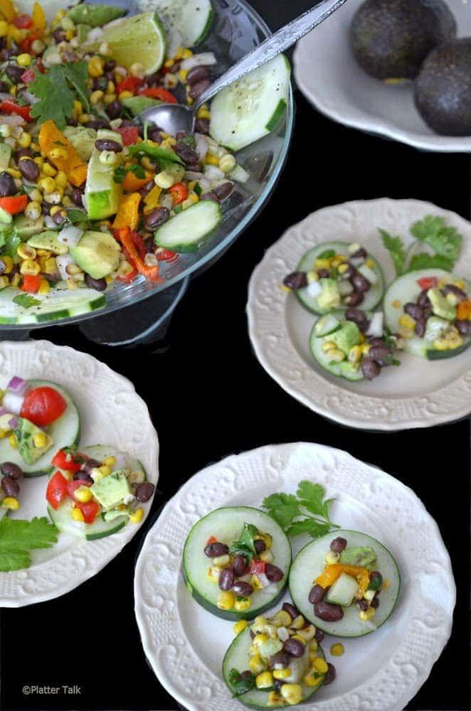 Slices of cucumber with corn salsa.