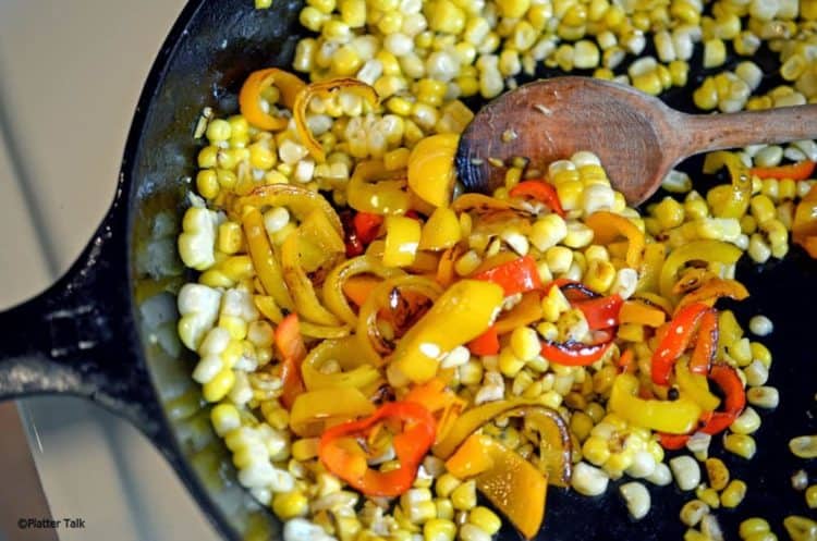 Corn and peppers in a pan.