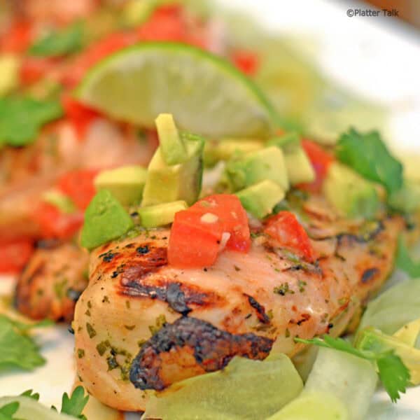 Some grilled chicken with avocado salsa.
