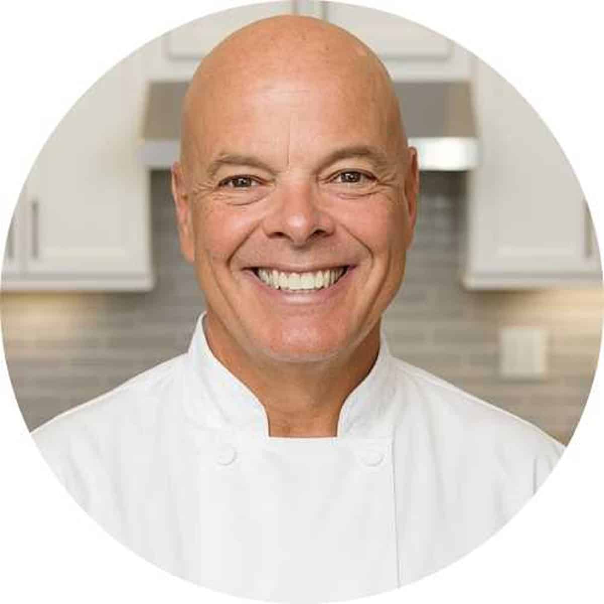A man in a chefs jacket.