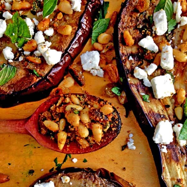 Some grilled eggplant topped with feta cheese.