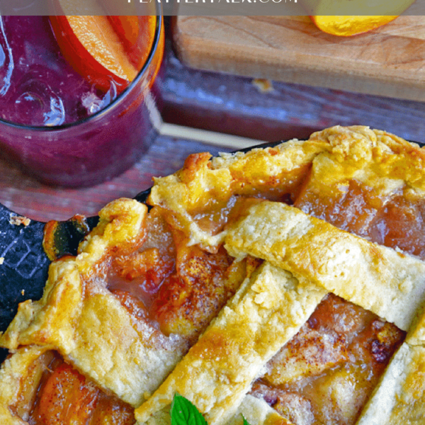 A close-up of a peach pie.