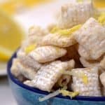 A bowl of food on a plate, with Lemon.