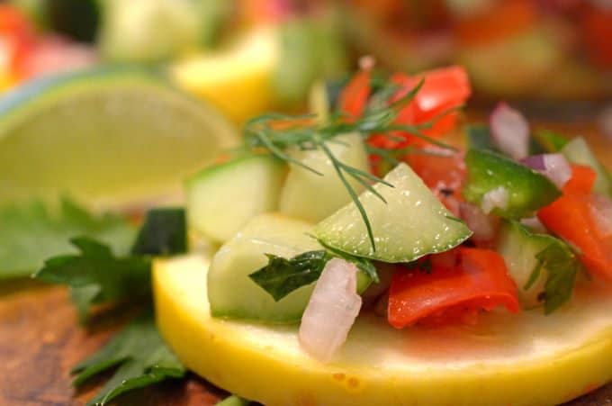 A plate of food, with Salsa and Cucumber