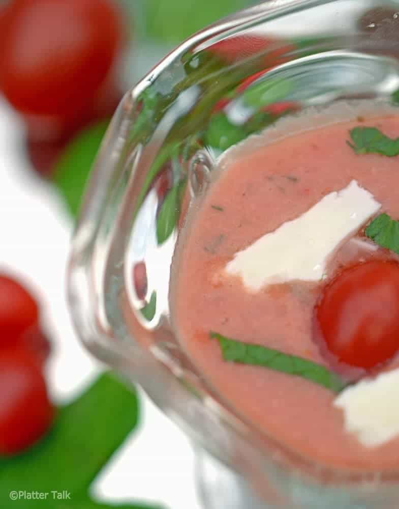 A bowl of tomato and strawberry gazpacho.