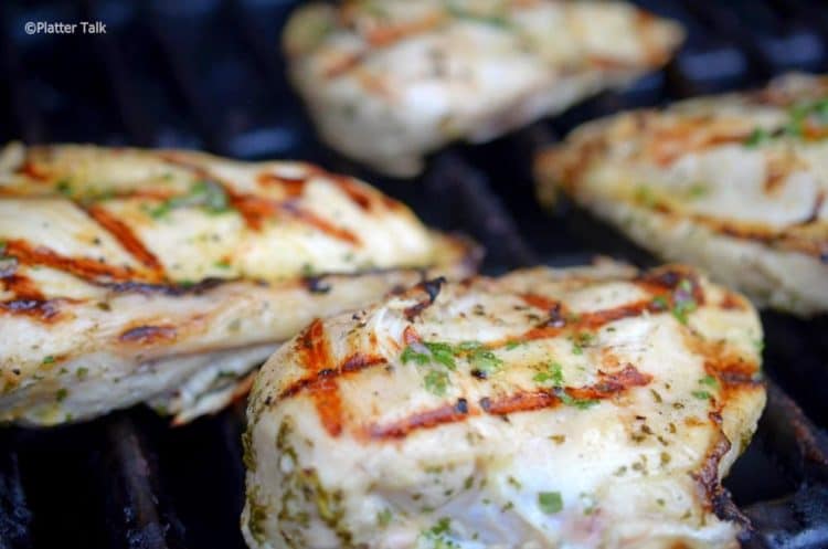 Chicken breasts on a hot grill.