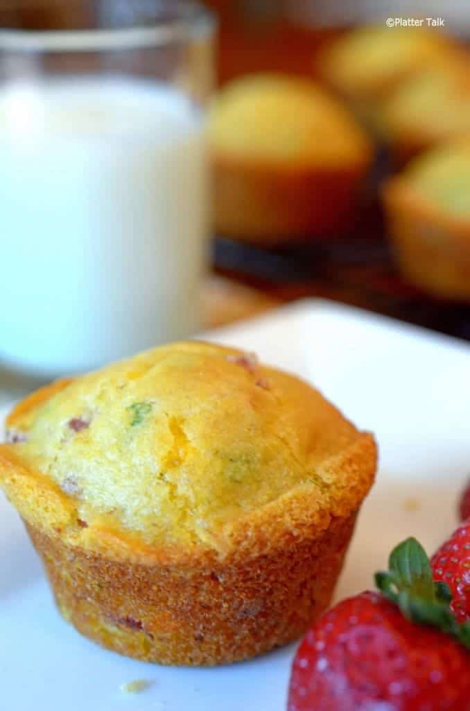 A close up of a ham and cheese muffin.