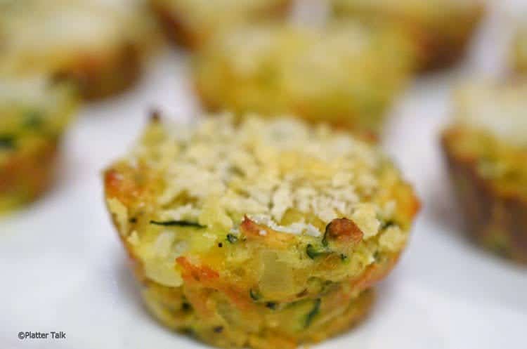 A close up of tater tots on a plate.