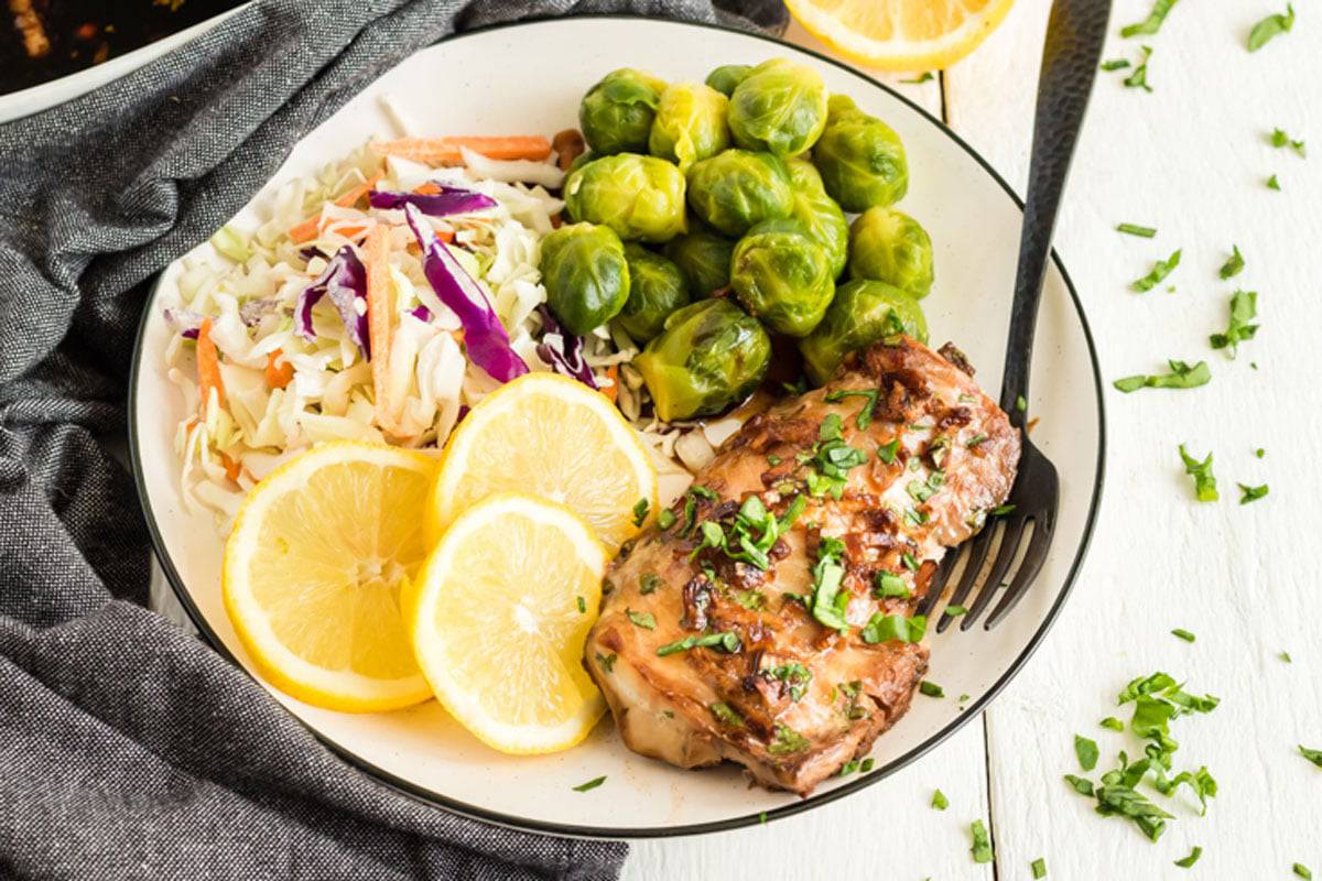 A plate of marinated haddock, Brussels sprouts and cole slaw