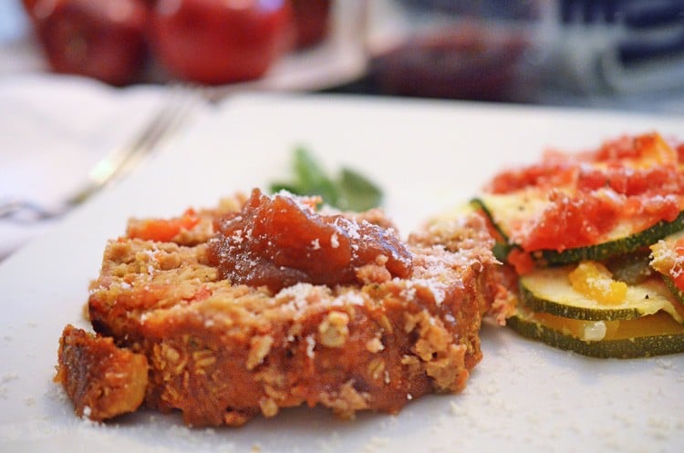 Slice of Apple meatloaf, topped with apple butter.