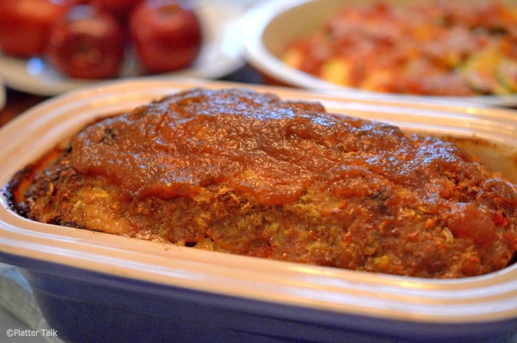 Pan of Amish meatloaf topped with apple butter.
