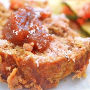 Slice of apple meatloaf topped with apple butter.