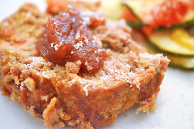 Slice of apple meatloaf topped with apple butter.