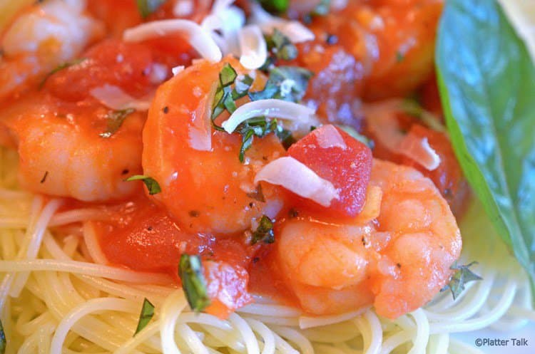 A close up of pasta with shrimp.