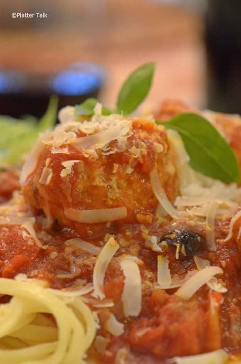 A close up of a plate of food, with Meatballs