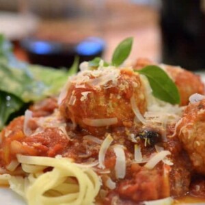 A close up of a plate of food, with Chicken Meatballs