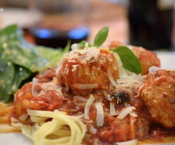 A close up of a plate of food, with Chicken Meatballs