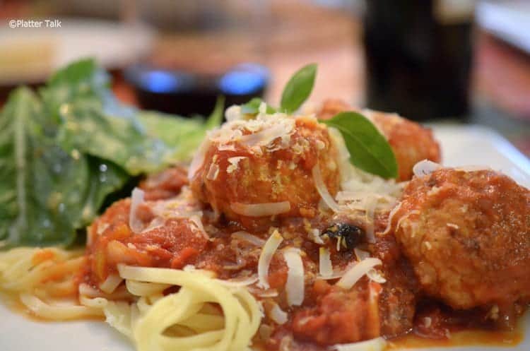 A close up of a plate of food, with Chicken Meatballs