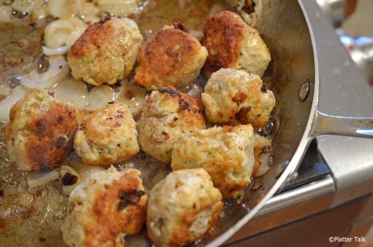 A pan filled with chicken meatballs