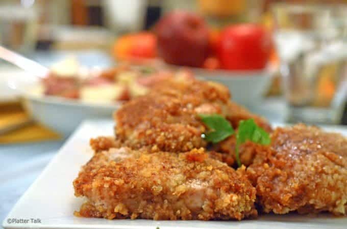 A close up of a plate of food, with pork Cutlets