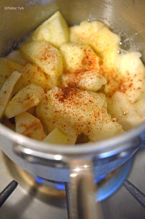 A close up of a bowl of apples