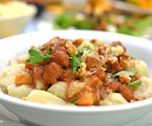 A close up of a plate of food, with Gnocchi and Sauce