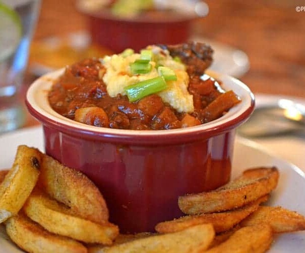 A bowl of chili with hominy.