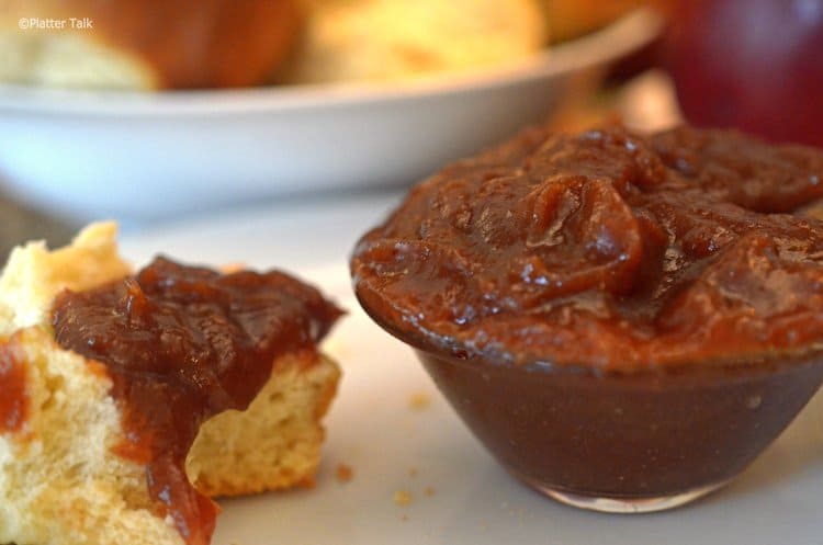 Dinner roll covered with apple butter.