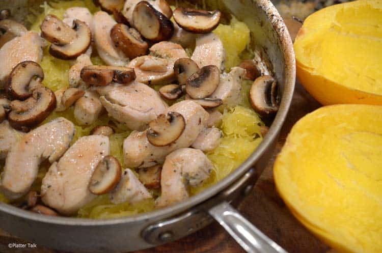 a pot of mushrooms and squash.