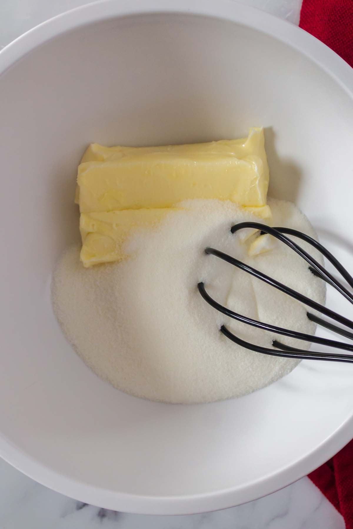 A mixing bowl of butter and sugar.