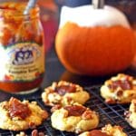 Pumpkin cookies on a cooling rack.