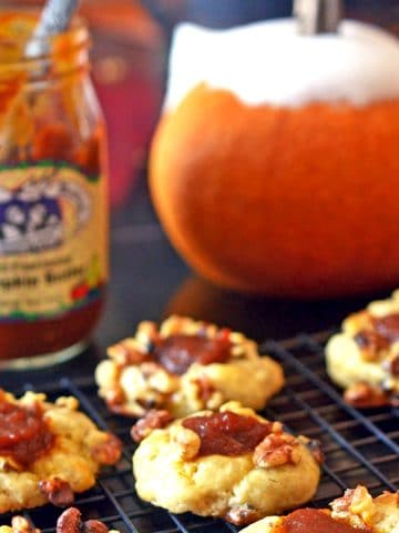 Pumpkin cookies on a cooling rack.