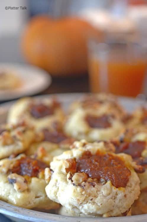 Plate of thumbprint cookies filled with pumpkin butter.