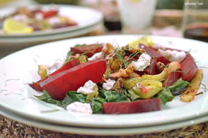 A plate of food on a table, with Chard and Platter