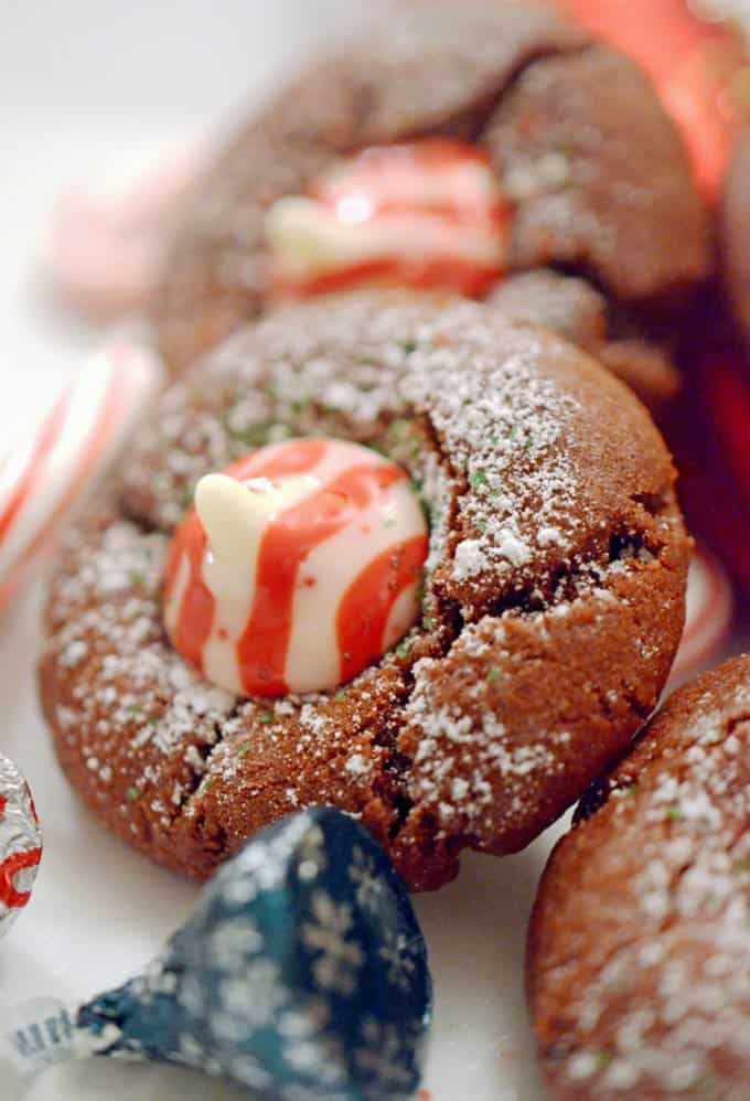 A close up of a chocolate cookie with candy canes