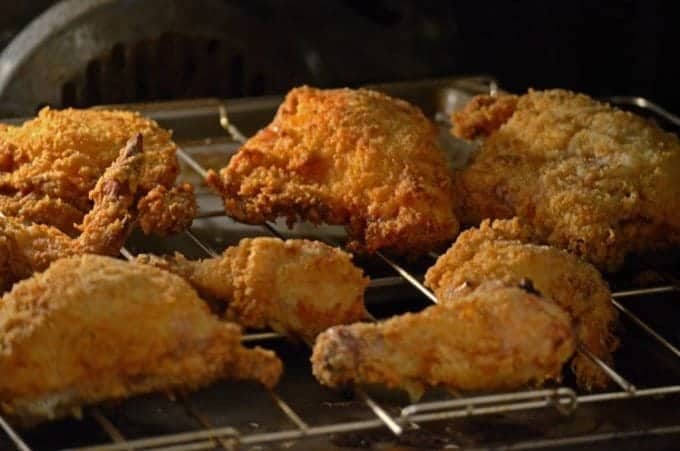 Butterrmilk oven fried chicken on an oven rack.