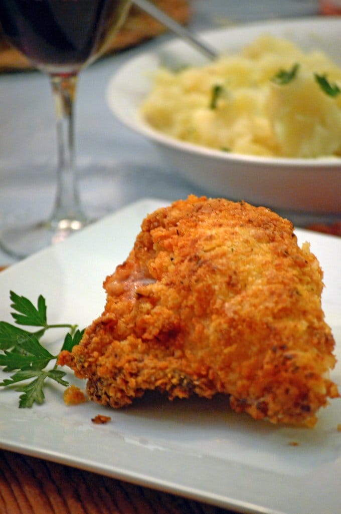 Buttermilk chicken thigh on a plate.
