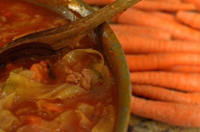 A close up of a bowl of food, with Soup 