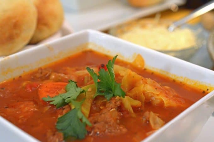 A bowl of food on a tray, with Soup