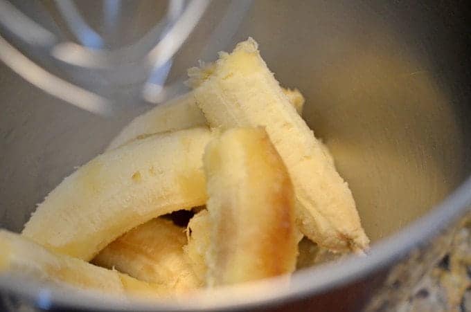 A close up of a bowl with mashed bananas