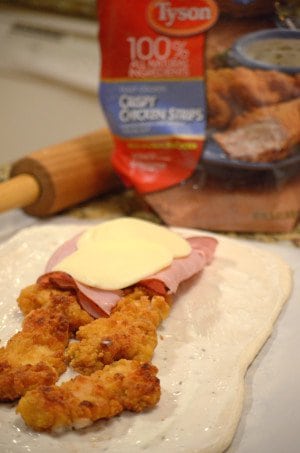 A plate of food on a table, with Chicken and Stromboli