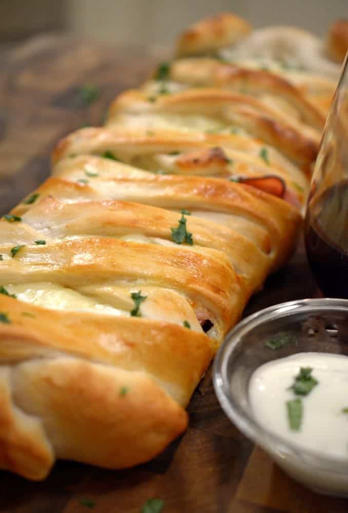 A close up of food on a table, with Chicken and Stromboli